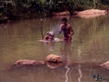 Finding drill hole underwater for insertion of lit dynamite.